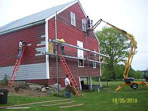 The crew installing vinyl siding 